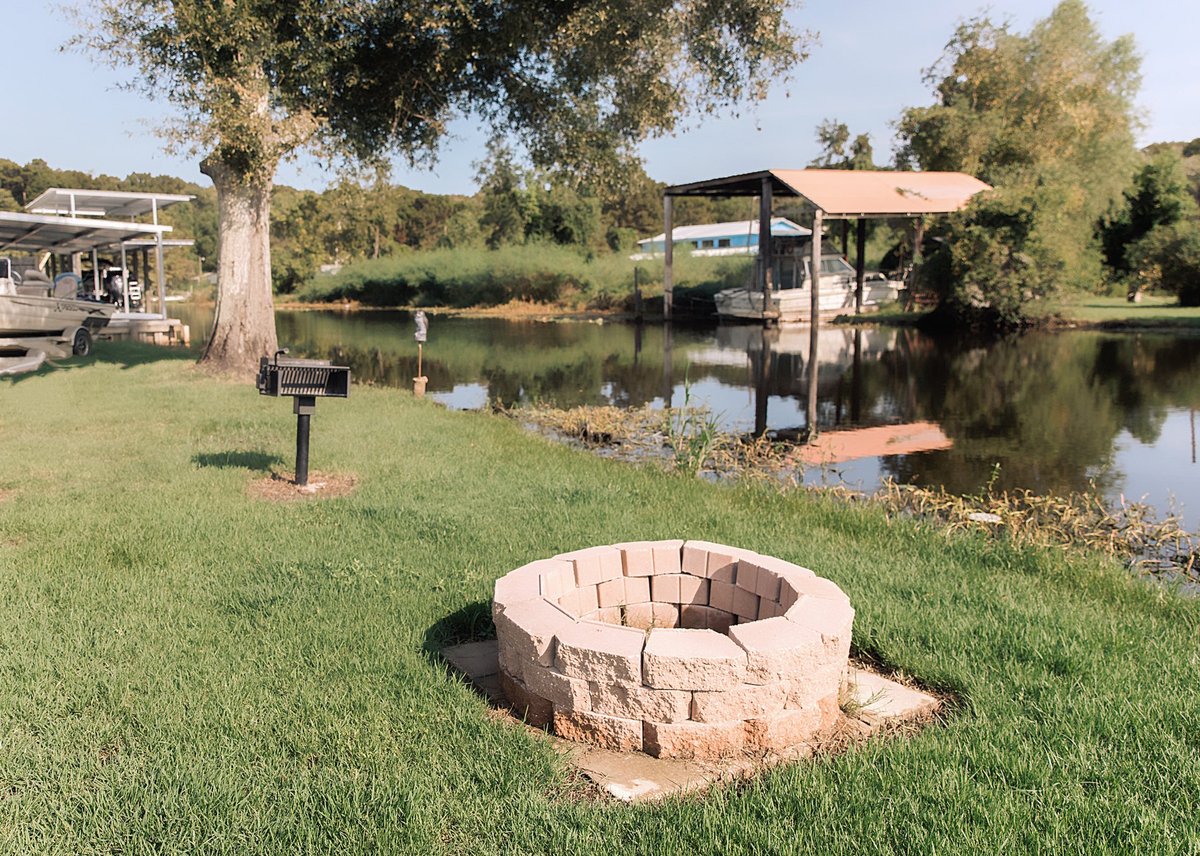 Brick fire pit overlooking the canal at Old River RV Park