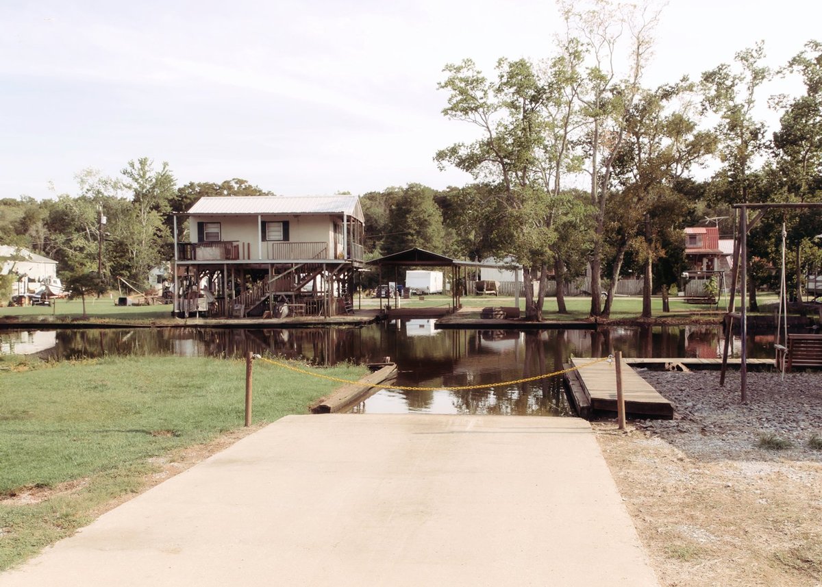 Concrete boat launch ramp leading into the water at Old River RV Park on the Amite River